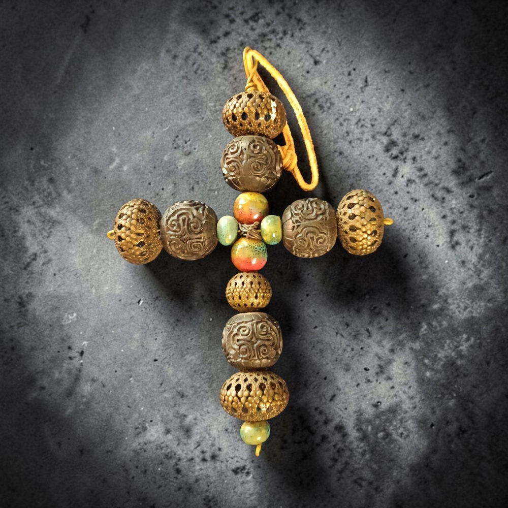 A Multicolor Bead and Bronze Tone Riticulated and Patterned Necklace